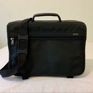Tumi messenger style briefcase. Tons of space!